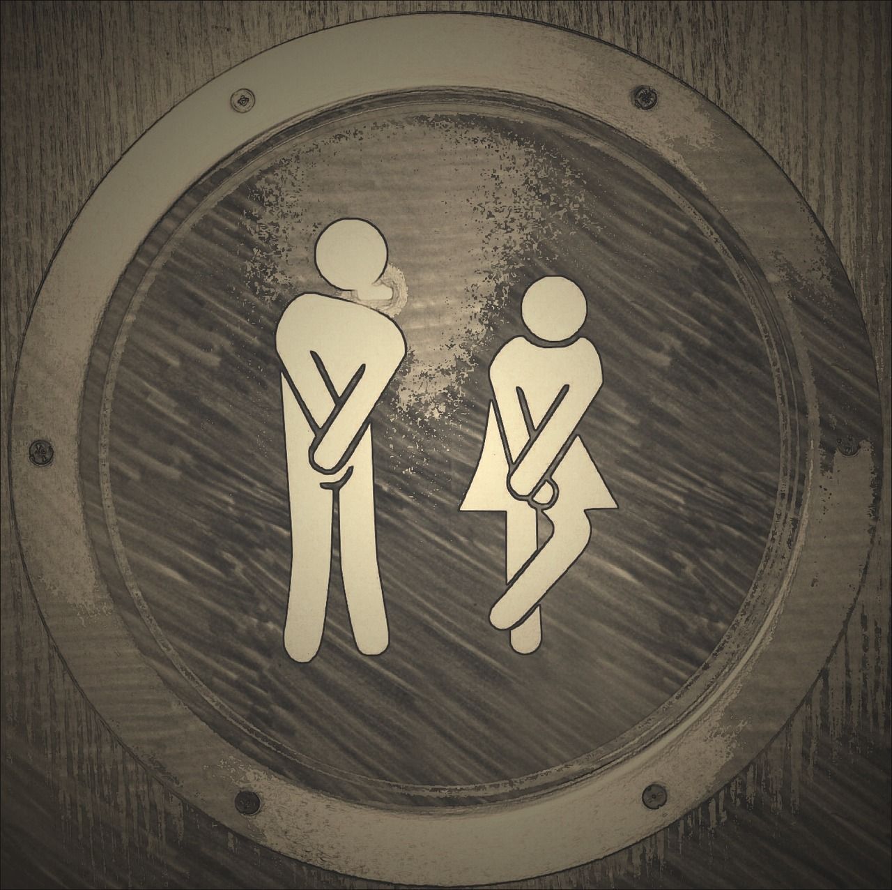 Ein Toilettenschild mit Mann und Frau drauf. 